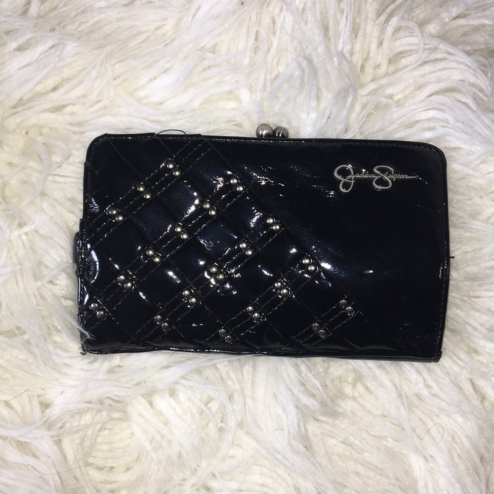 Jessica Simpson- black clutch